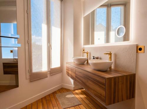 two sinks in a bathroom with two windows at Spacious Designer Duplex 9 Guests Fully Renovated in Châtillon
