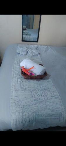 a bed with two pillows on top of it at H&Dluxe in Murangʼa
