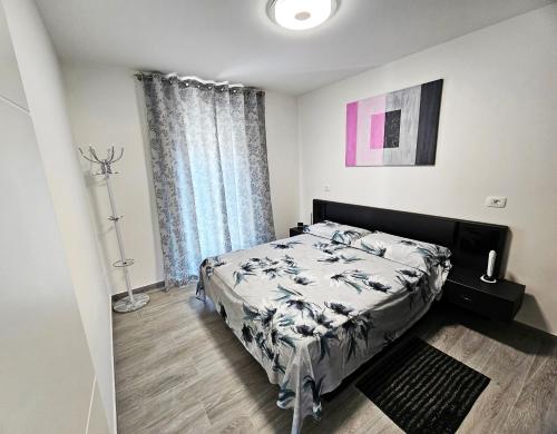 a bedroom with a bed and a large window at APP Mary in Novigrad Istria