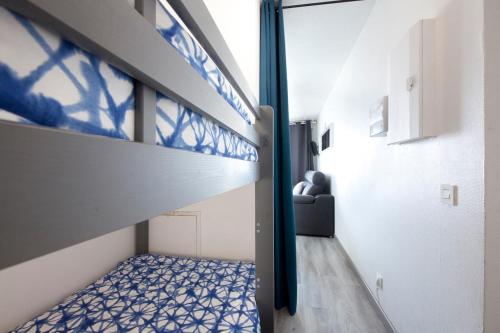a room with a loft bed and a couch at Sokoburu Deluxe Beach in Hendaye