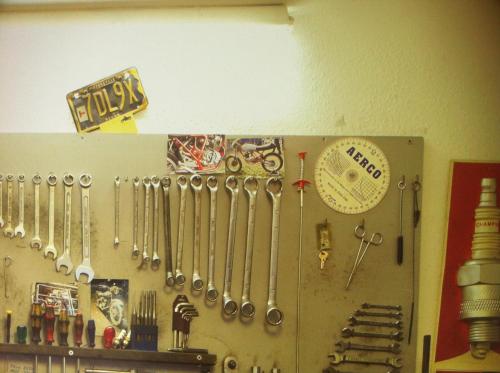 a bunch of utensils hanging on a wall at Max Hostel in Bonn