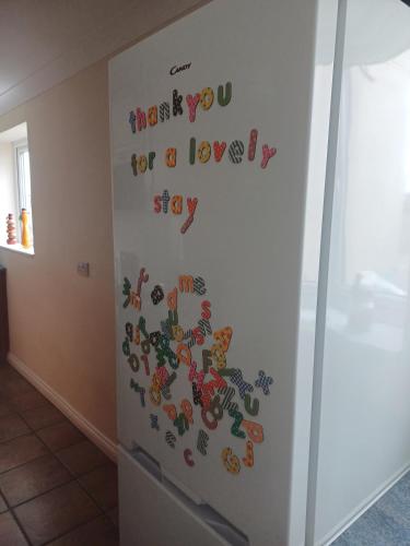 a refrigerator with the words thank you for a lovesky stop at Large countryside home in Tow Law