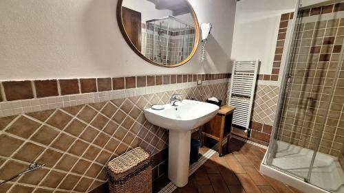 a bathroom with a sink and a mirror at Ca' Bianca in Lugo
