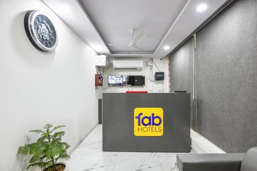 an office with a fico studios sign on the wall at FabHotel Evegreen, Faridabaad in Faridabad