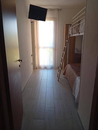 a room with a bunk bed and a window at Casa Rotary in Lugo