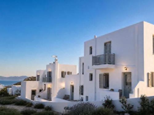 a white building with a view of the ocean at Gaia Serifos Apartments in Rámos