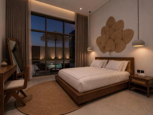 a bedroom with a bed and a large window at يونوبي Yonobi in Medina