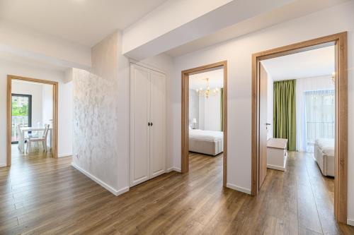 an apartment with a bedroom and a living room at KOA - Aparthotel in Braşov