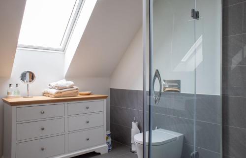 a bathroom with a shower and a toilet at Cnoc Na Lobhta in Husabost