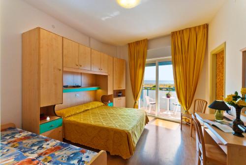 A bed or beds in a room at Hotel Gimm