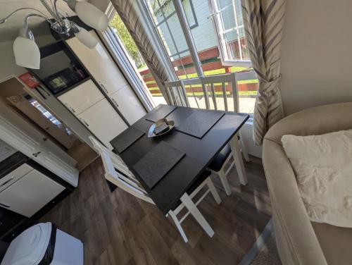 a small dining room table in a tiny house at J&J Retreat in Morpeth