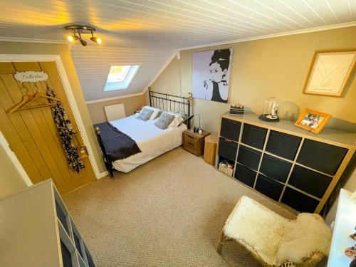 a small bedroom with a bed and a window at Stags View in Invergarry