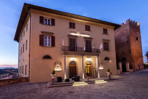 a large white building with a large window at Hotel Miravalle in San Miniato