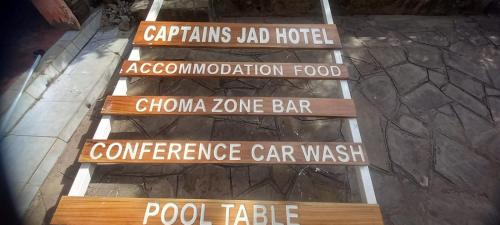 a set of stairs with different signs on them at Jad Captains Hotel in Machakos