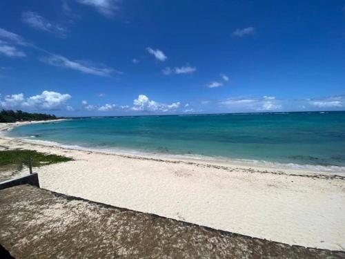 a view of a beach with the ocean at La Plage I Beachfront Villa on the Lagoon in Centre de Flacq