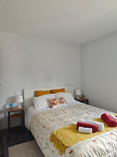 a bedroom with a bed with two pillows on it at Marca 34 in Monção