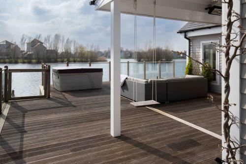 a deck with a large view of the water at Summer Lake in South Cerney