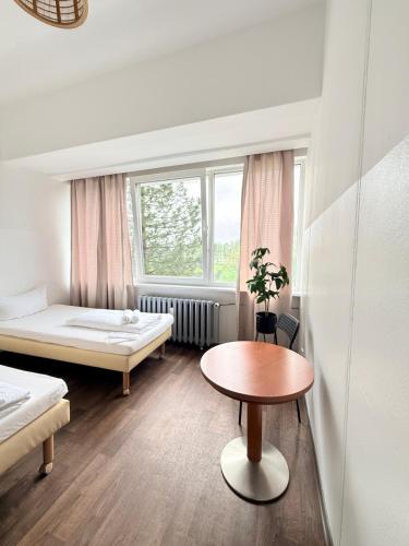 En eller flere senge i et værelse på Ootel Berlin