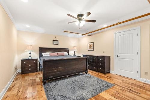 a bedroom with a bed and a ceiling fan at The Dolly Printer's Alley Nashville- 2 Blocks to Broadway in Nashville