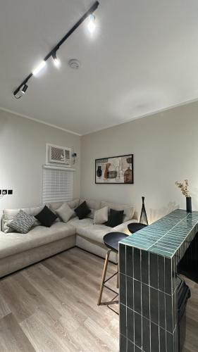 a living room with a couch and a table at شقق مخدومة in Jazan