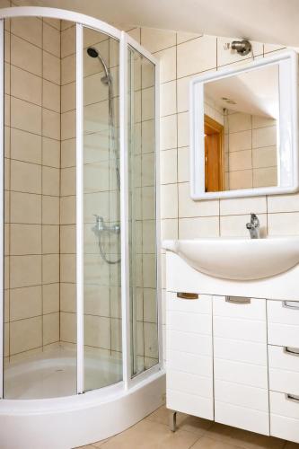a bathroom with a shower and a sink at Guest House Maritimo in Sukošan