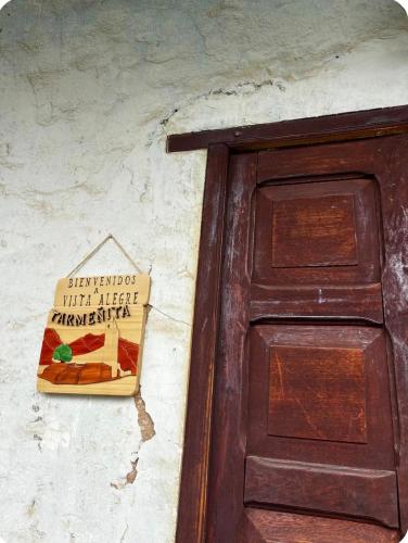 a sign on a wall next to a door at Tarmeñita VIP in Tarma