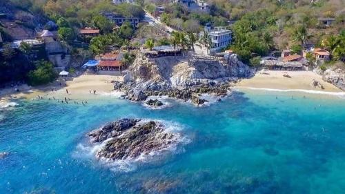 an aerial view of a beach at Macondo GuestHouse Beach in Playa Estacahuite