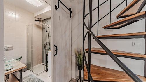 a bathroom with a staircase leading to a shower and a sink at Villa Anna by Villas Guide in Vela Luka