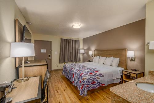 a hotel room with a bed and a sink at Baymont by Wyndham Socorro in Socorro