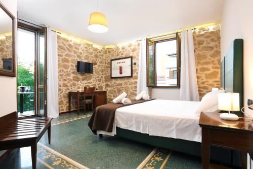 Postel nebo postele na pokoji v ubytování Bienestar - Maison de Charme