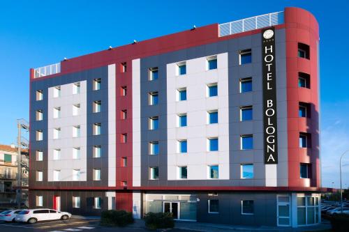 a hotel with a red and white building at My One Hotel Bologna in Bologna