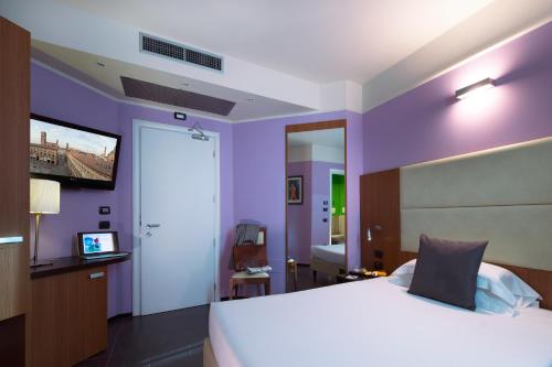 Giường trong phòng chung tại CDH My One Hotel Bologna