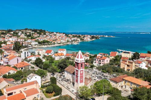 an aerial view of a town with a clock tower at Villa Vita Mare in Preko