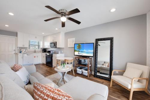 a living room with a couch and a mirror at Bay Tree B3 in Port Aransas