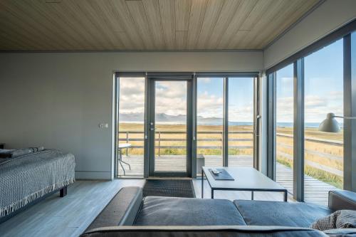 a living room with a couch and a table at Dis Cottages in Grundarfjordur