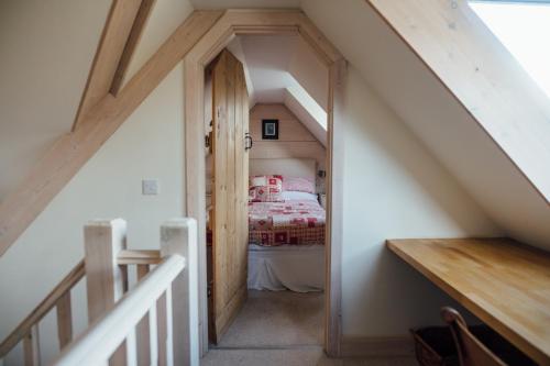 a hallway leading to a bedroom in a house at Kathleen's Croft, charming detached croft house in Torridon