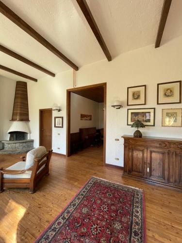 a living room with a couch and a fireplace at Casa dell'OCA in Viganò