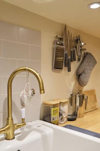 a kitchen counter with a sink and aaucet at The Apartment at Charles Road in Frome