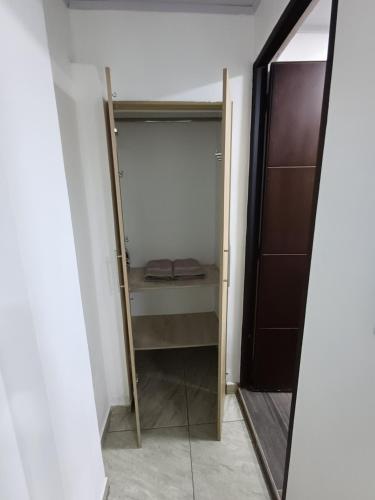 a walk in closet with a mirror in a room at APARTA ESTUDIO CONDO in Villavicencio