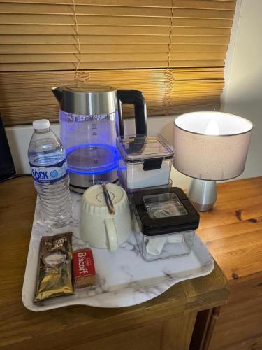 a table with a blender and a bottle of water at The Dublin Packet- Single Room 7 in Holyhead