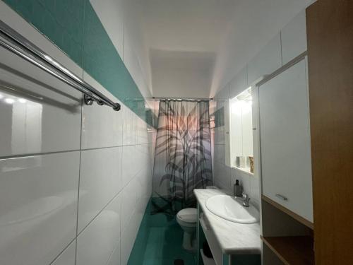 a bathroom with a sink and a toilet and a shower at La Dimora di Basilica in Ágios Matthaíos