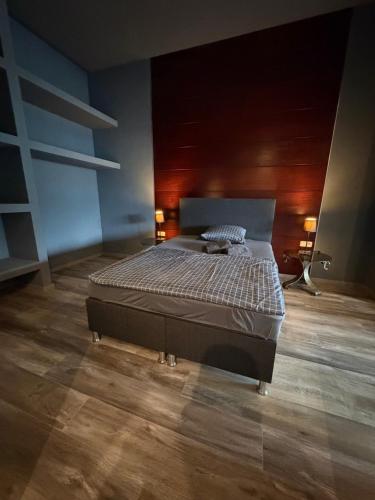 a bedroom with a large bed in a room at Smartstay Porta in Porta Westfalica