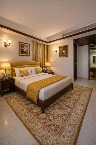 a large bedroom with a large bed and a rug at Goyal Hotelirs - Hotel The Agra Grande, Agra in Agra