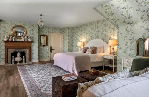 a bedroom with a bed and a fireplace at Whistler Rooms in Peterborough
