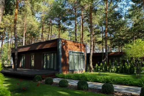 a small house in the middle of a forest at Grace Place in Soshnikov
