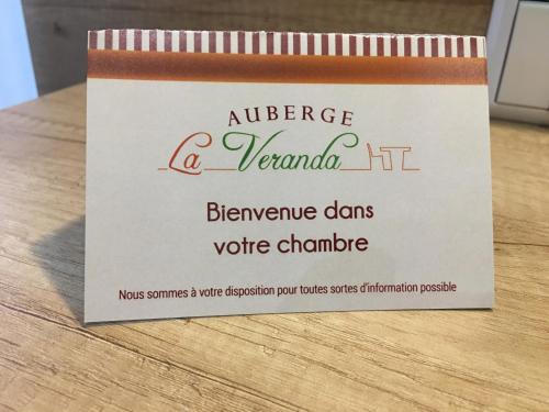 a sign that says audience a verona it refrigeratords voice change at Auberge La Veranda in Luxembourg