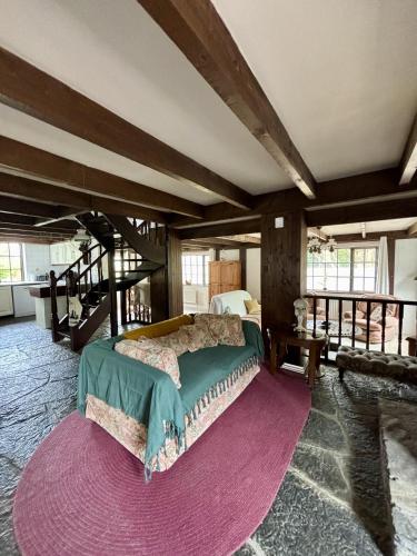 a bedroom with a large bed in a room at Bay View Ridge Cottage in Bantry