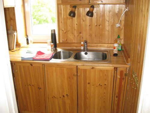 a kitchen counter with a sink and a window at Ferienwohnung Gutzeit in Flensburg