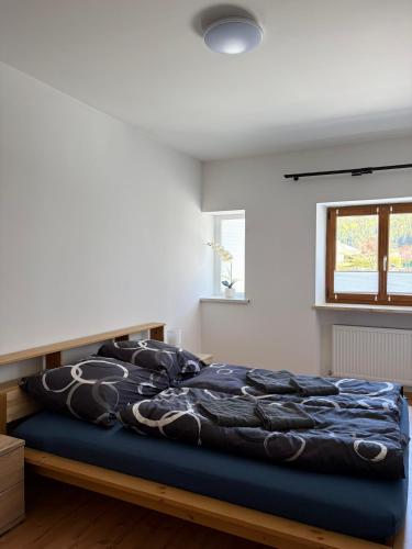 a bedroom with a bed with a blue mattress at Patrycja 2 in Ehenbichl