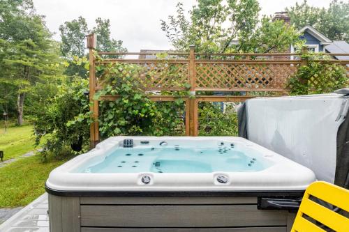 a jacuzzi tub sitting on a patio at 1890 CapeCod farmhouse:Charming, Private, Spacious in Saugerties